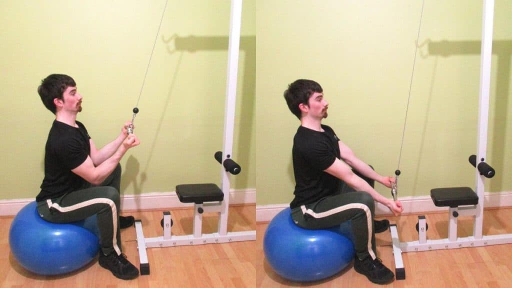 A man doing a reverse grip stability ball pushdown for his triceps