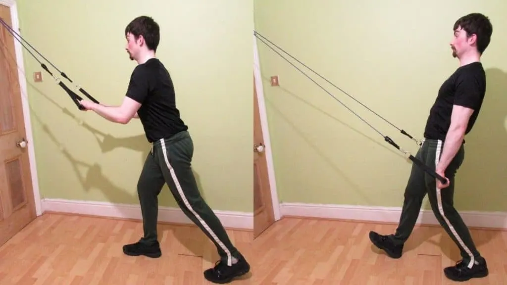 A man doing a rocking tricep pushdown with resistance bands