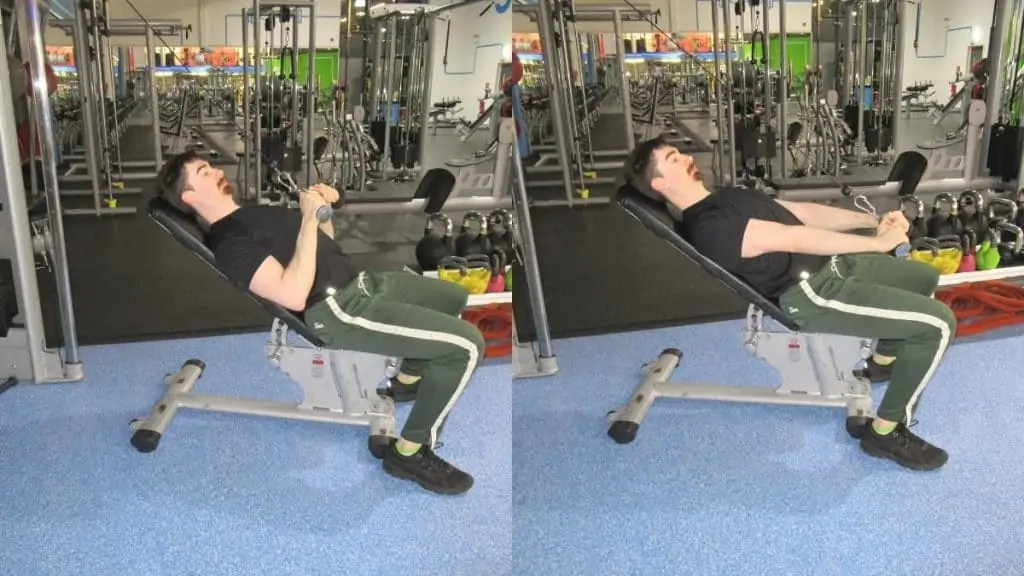 A man performing a seated cable tricep pushdown