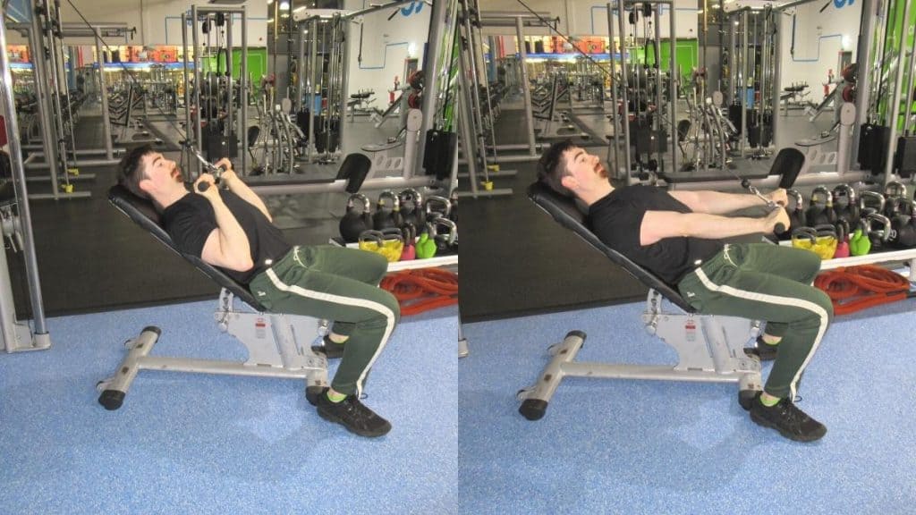 A man performing a seated triceps pushdown