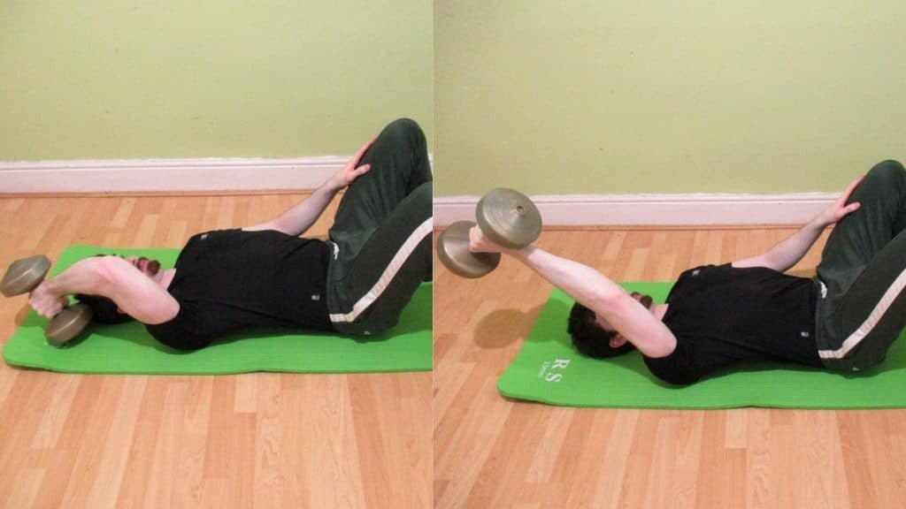 A man doing a single arm floor skull crusher