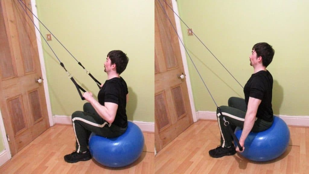 A man performing a stability ball band tricep pushdown