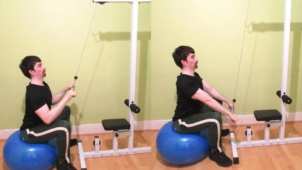 A man doing a stability ball straight bar pushdown