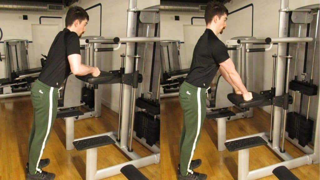 A man doing a tricep pressdown on an assisted pull up machine