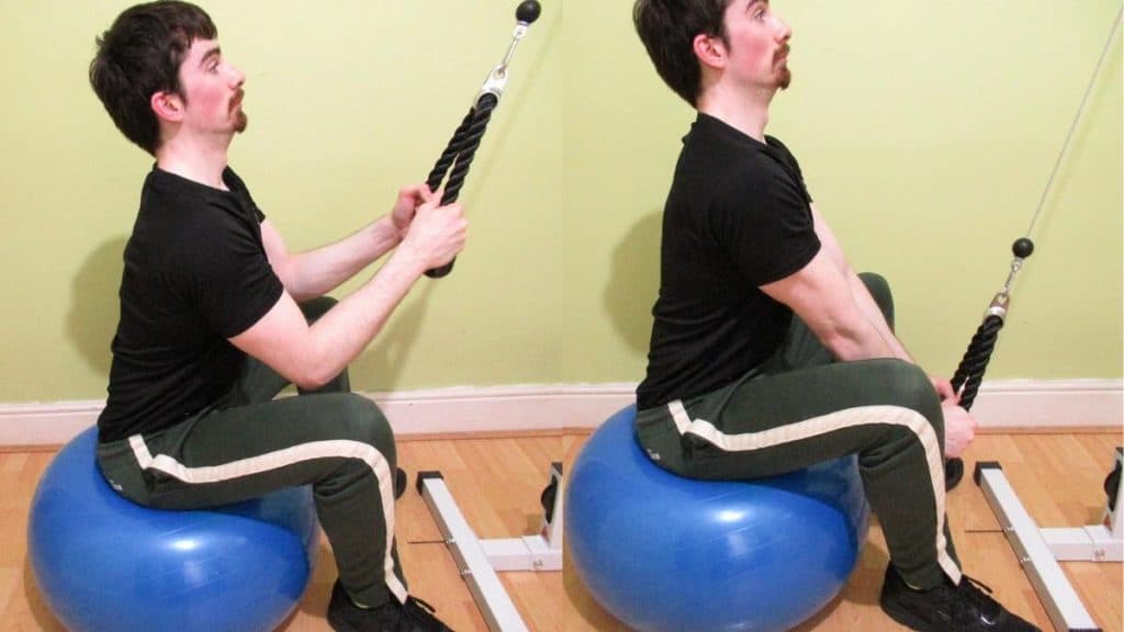 A man performing tricep pushdowns on an exercise ball