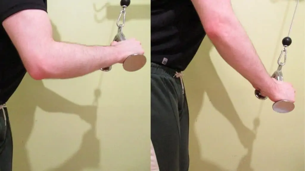 A man doing tricep pushdowns with a v bar attachment