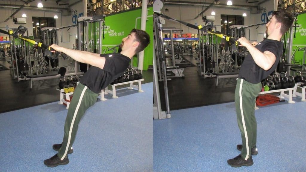 A man making a common TRX reverse curl mistake: turning it into a row