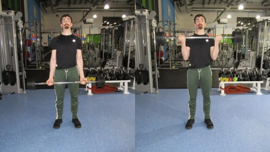 A man performing a 100 lb barbell curl for his biceps