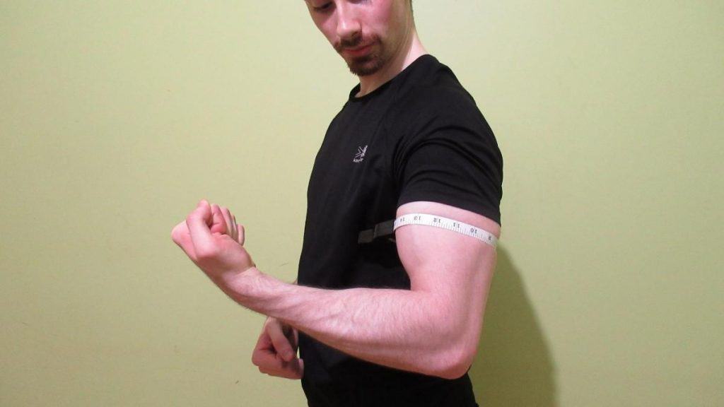 A man with 15.5 inch biceps flexed