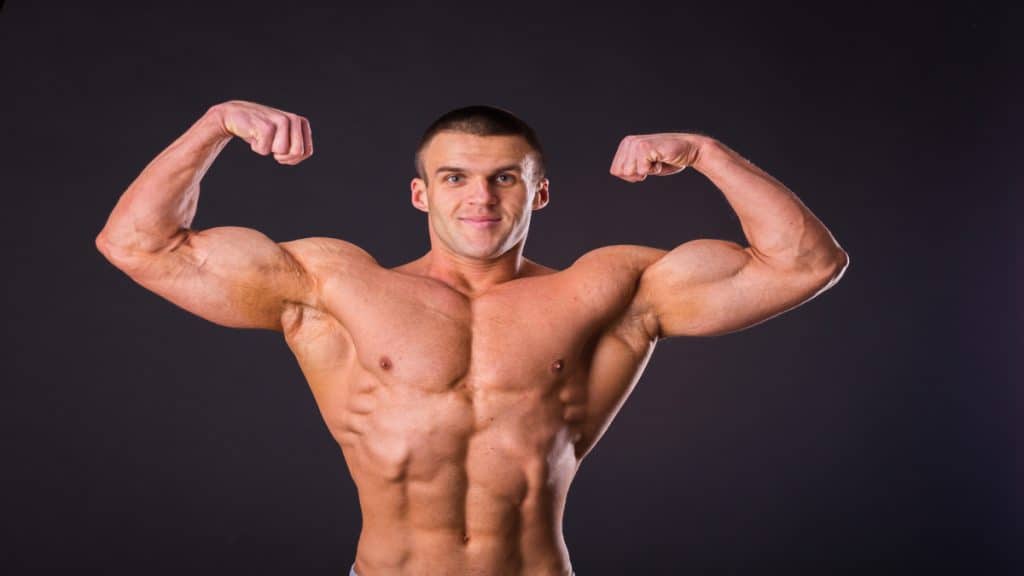 A bodybuilder with 20 inch biceps flexed