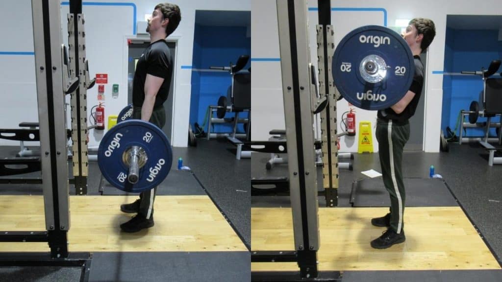 A man doing a 60 kg barbell curl for his biceps