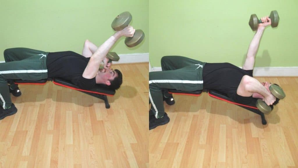 A man doing an alternating decline dumbbell triceps extension