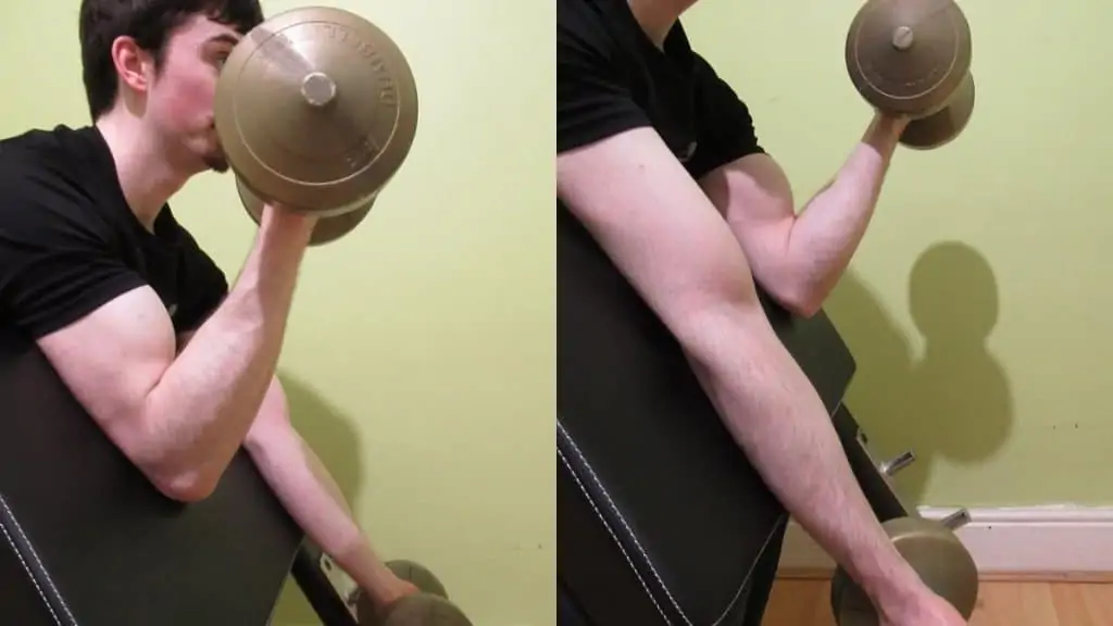 A man doing an alternating preacher bicep curl