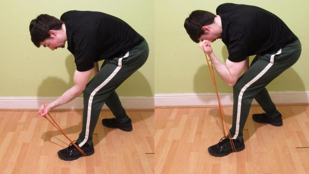 A man performing a band spider curl