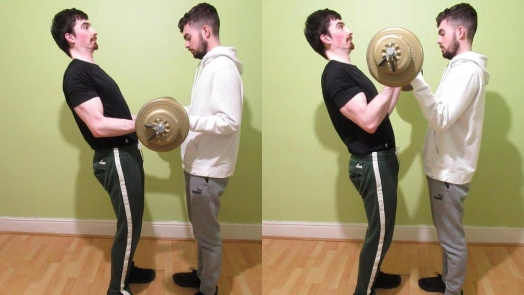 A man doing barbell buddy curls for his biceps with his training partner