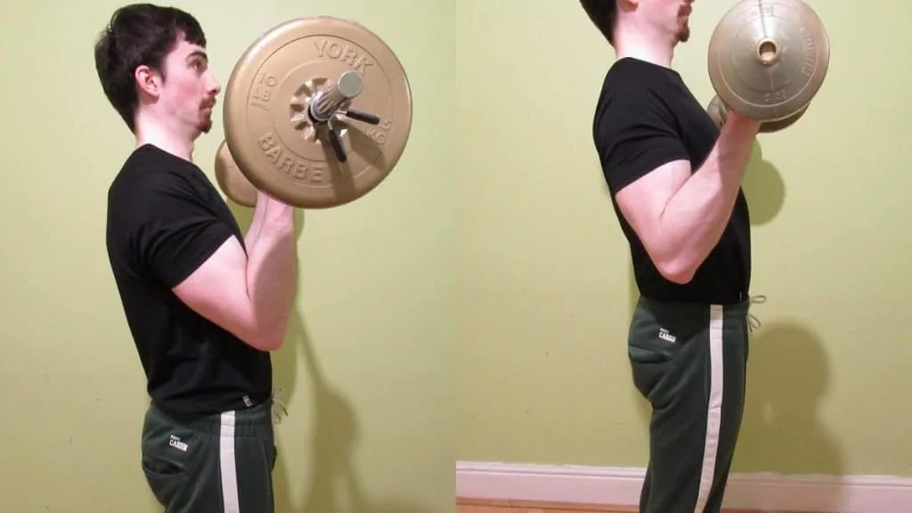 A weight lifter performing a barbell curls vs dumbbell curls comparison to show the key differences