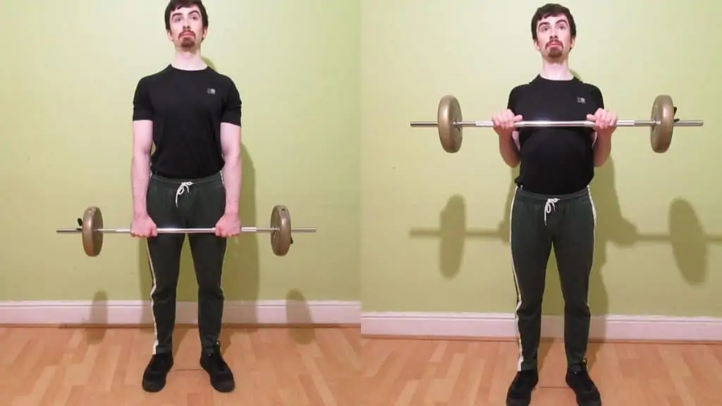 A man doing a barbell reverse grip drag curl