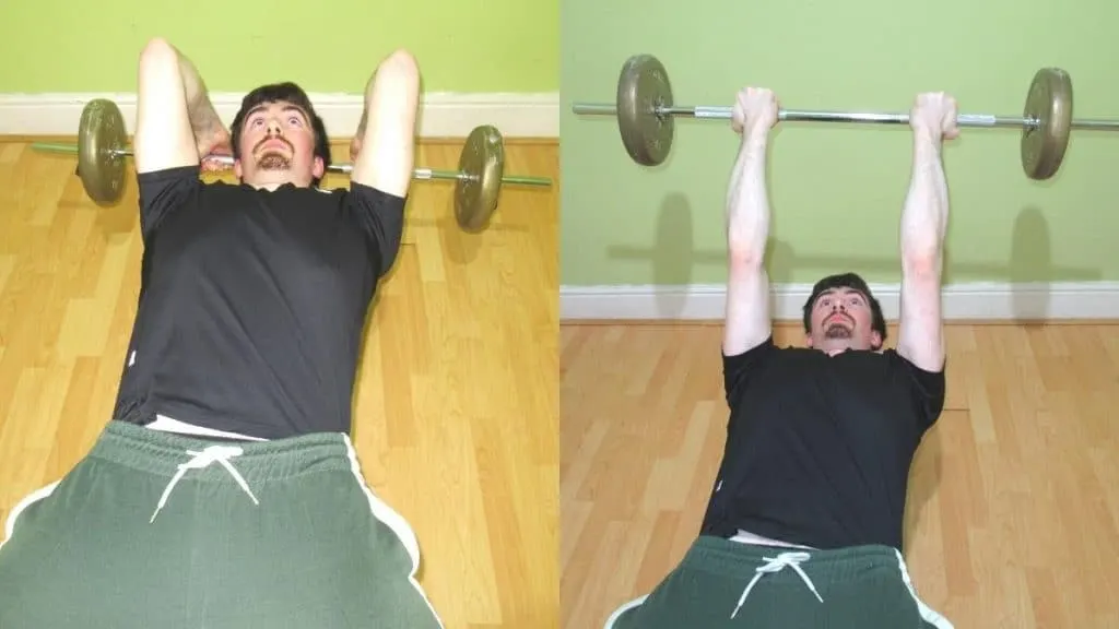 A man doing a barbell reverse grip skull crusher