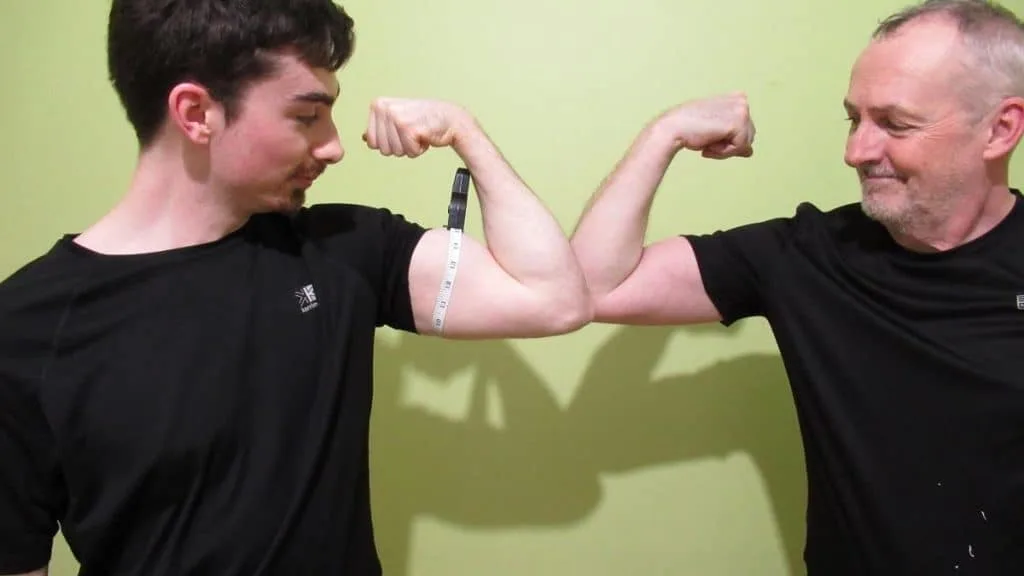 A man with a bigger bicep peak than the other guy