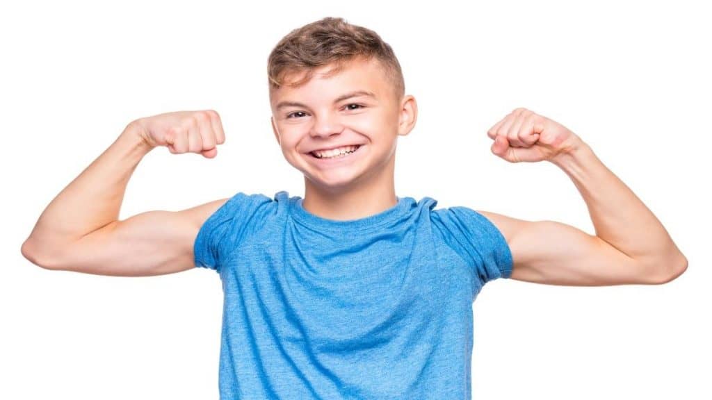 A boy flexing his biceps