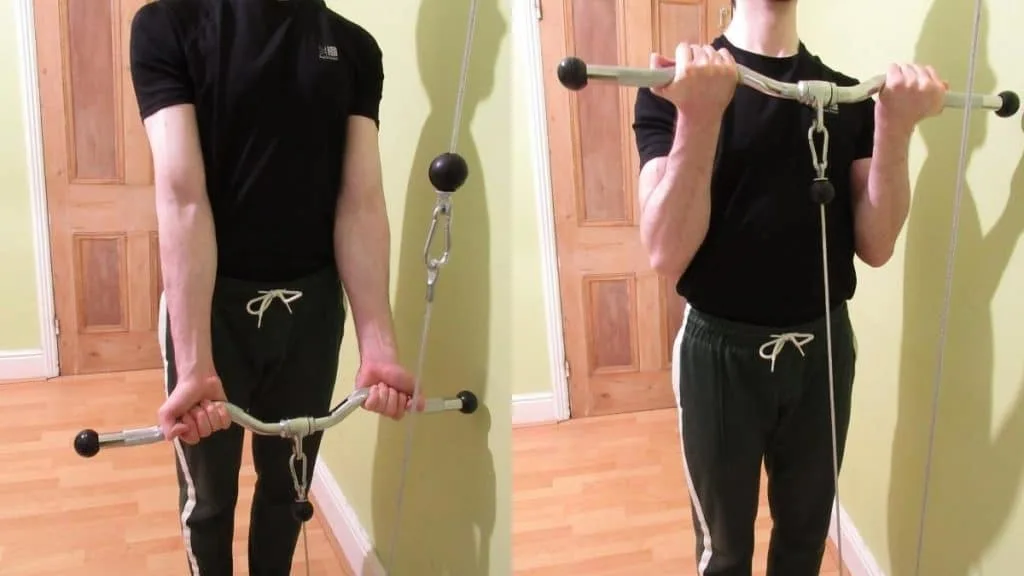 A man performing some cable machine bicep exercises during his workout