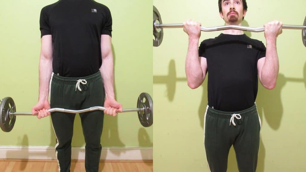 A man performing a cambered bar curl to work his biceps