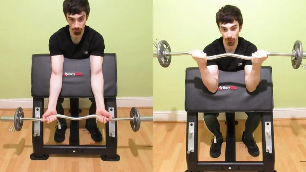 A man doing some cambered bar preacher curls