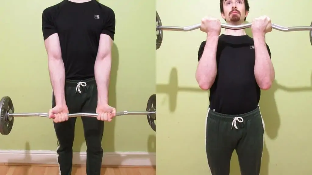 A man performing close grip EZ bar curls to work his biceps