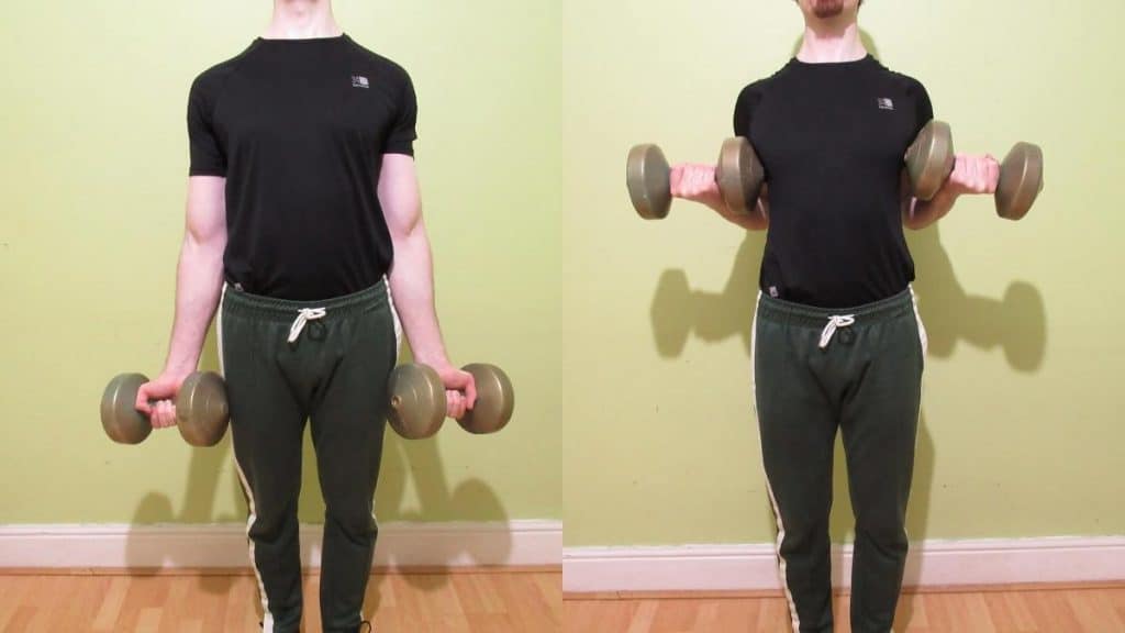 A man performing a dumbbell drag curl for his biceps