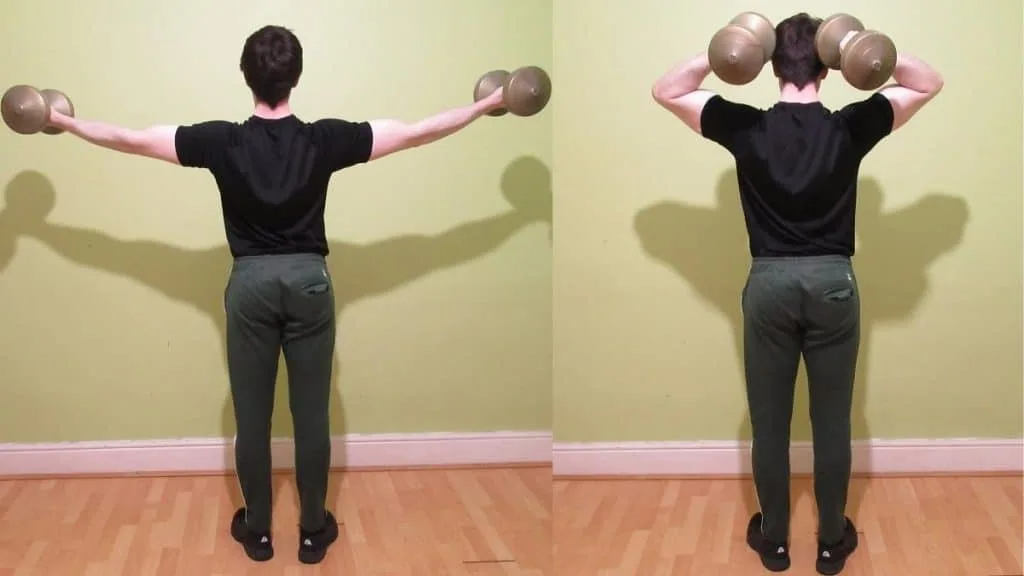 A man doing dumbbell high curls for his biceps