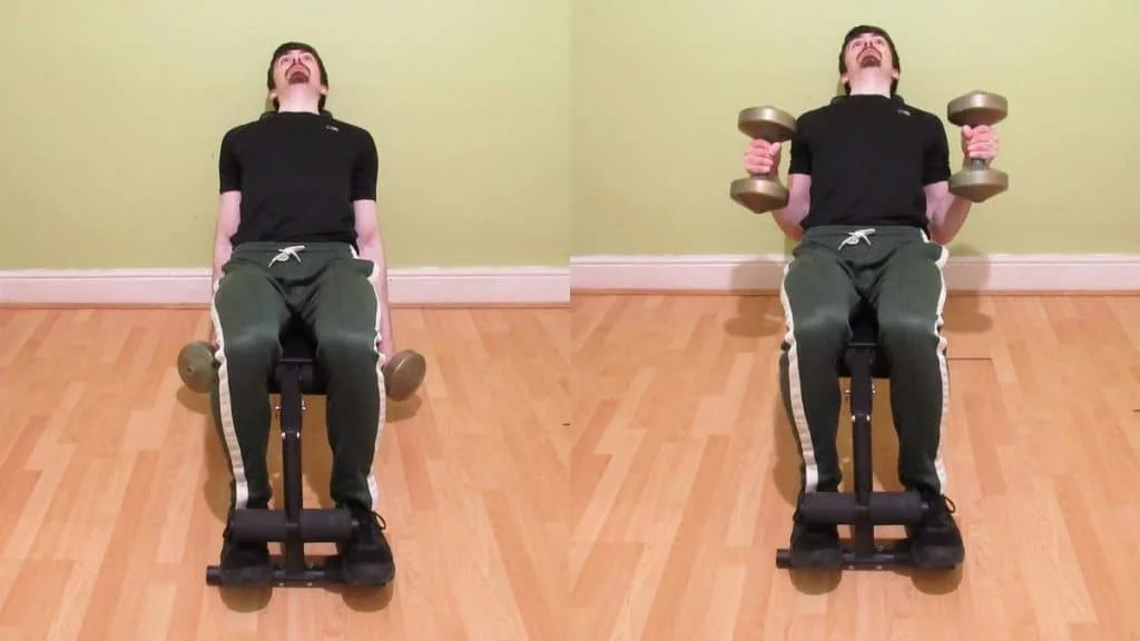 A man doing dumbbell incline hammer curls for his biceps