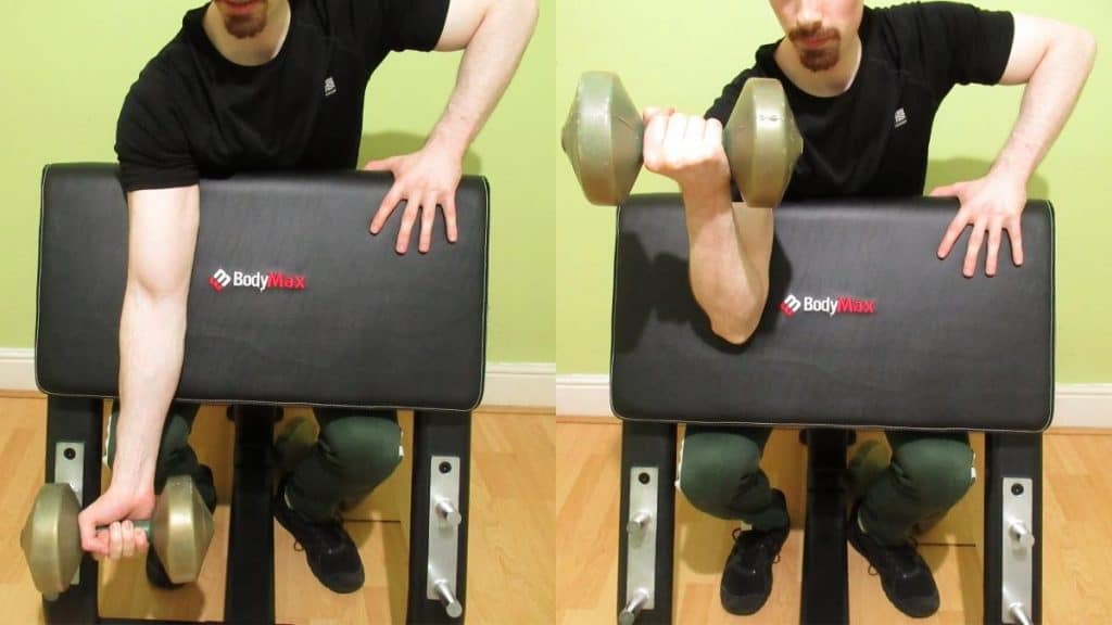 A man doing a one arm dumbbell Scott curl for his biceps