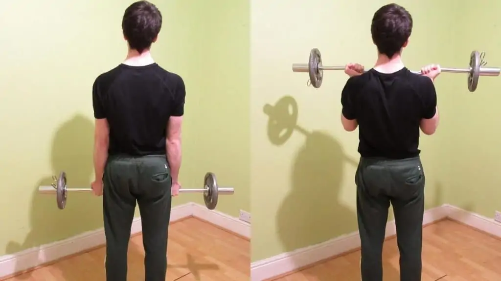 A man performing easy bar curls for his biceps