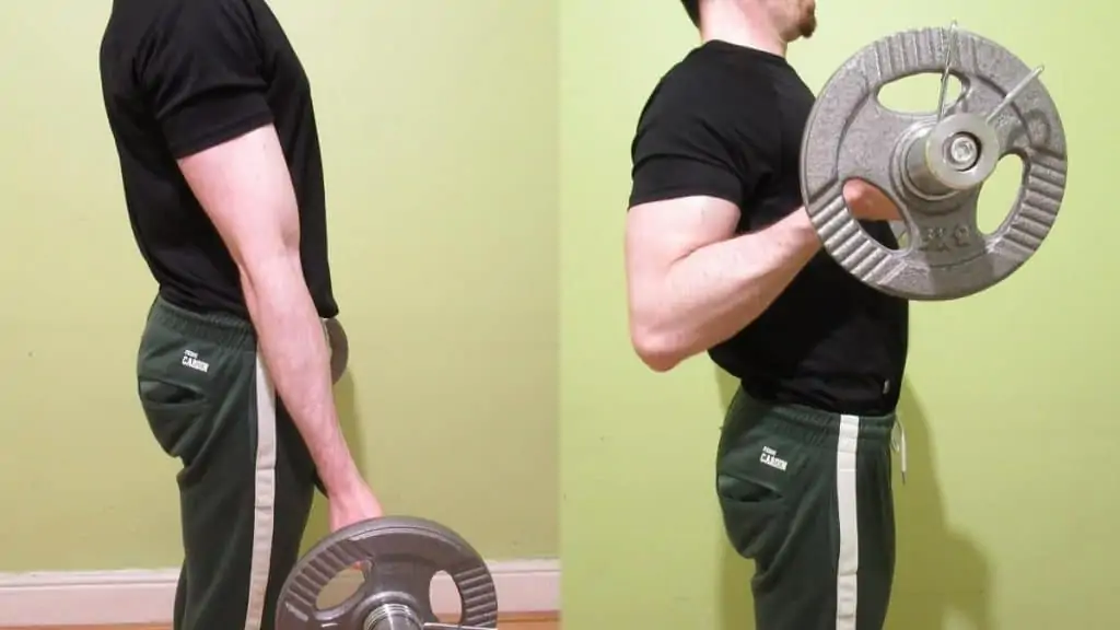 A man performing an EZ bar drag curl for his biceps