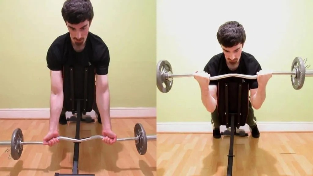 A man performing an EZ spider curl