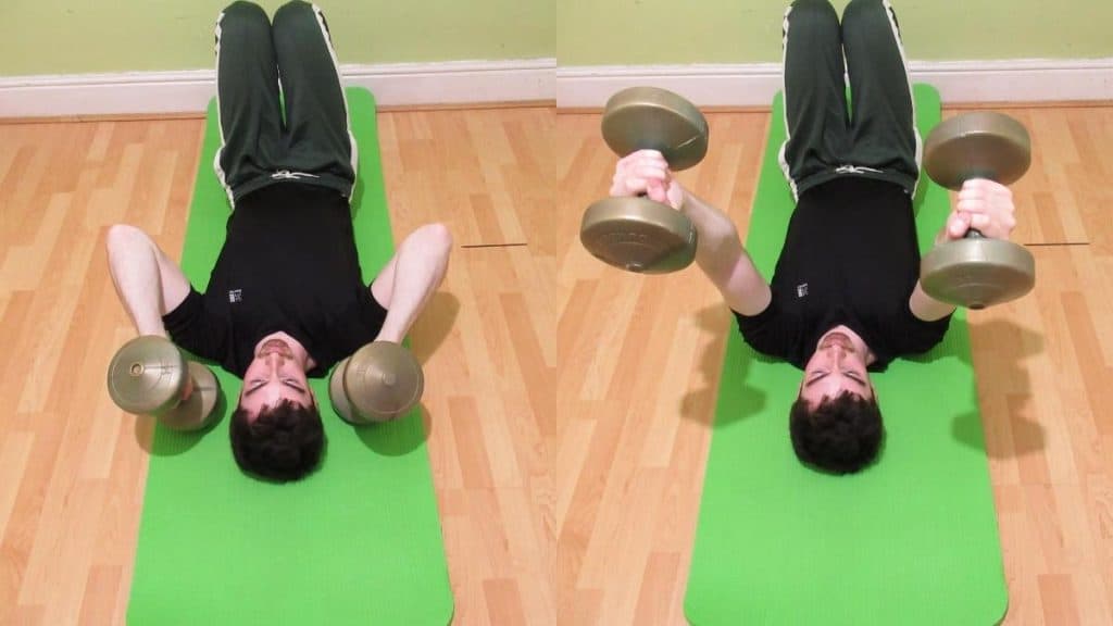 A man doing a floor lying triceps extension