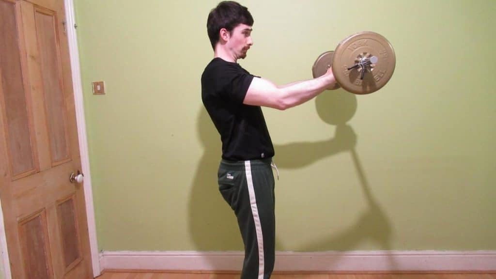 A man doing a barbell forhead curl