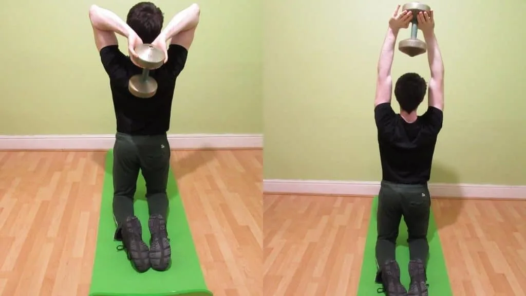 A man doing a kneeling French press with a dumbbell