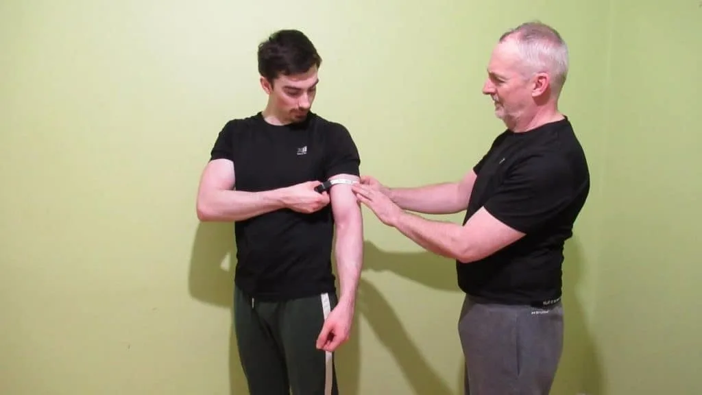 A 6 foot tall man having arms and biceps measured