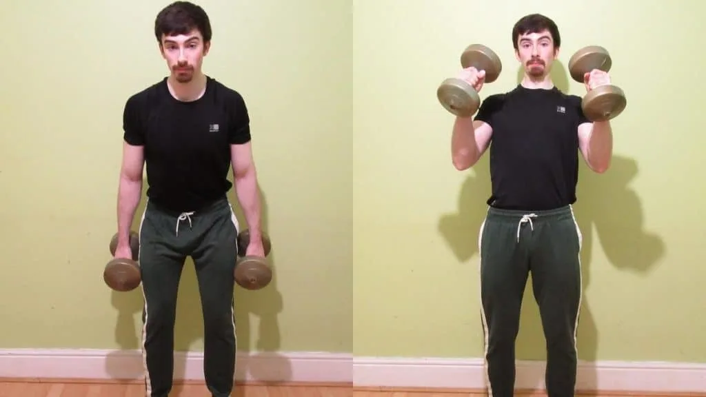 A man doing a hammer cheat curl with dumbbells