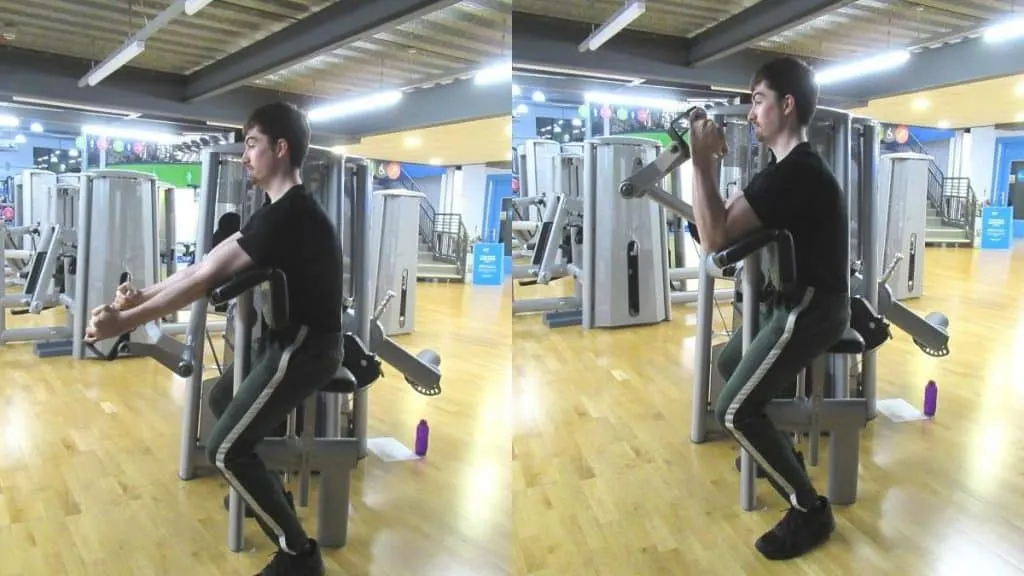 A man doing hammer curls on the bicep machine