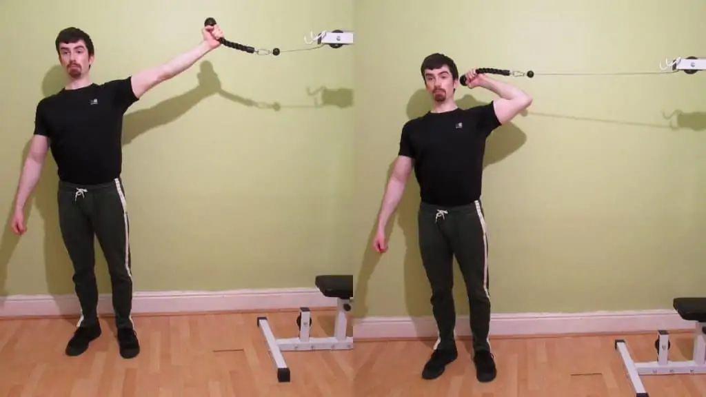 A man performing high cable bicep curls