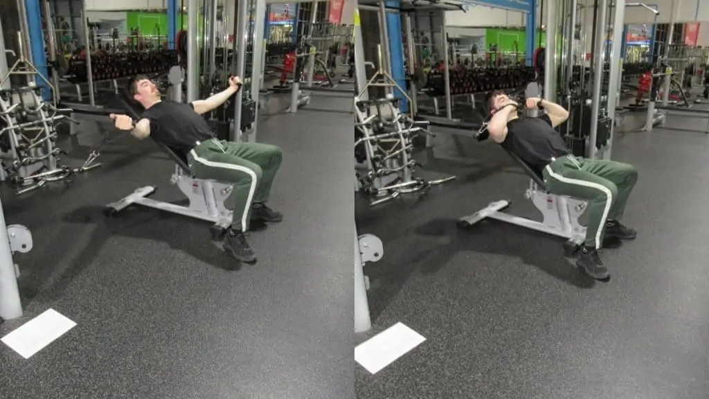 A man doing some incline cable curls