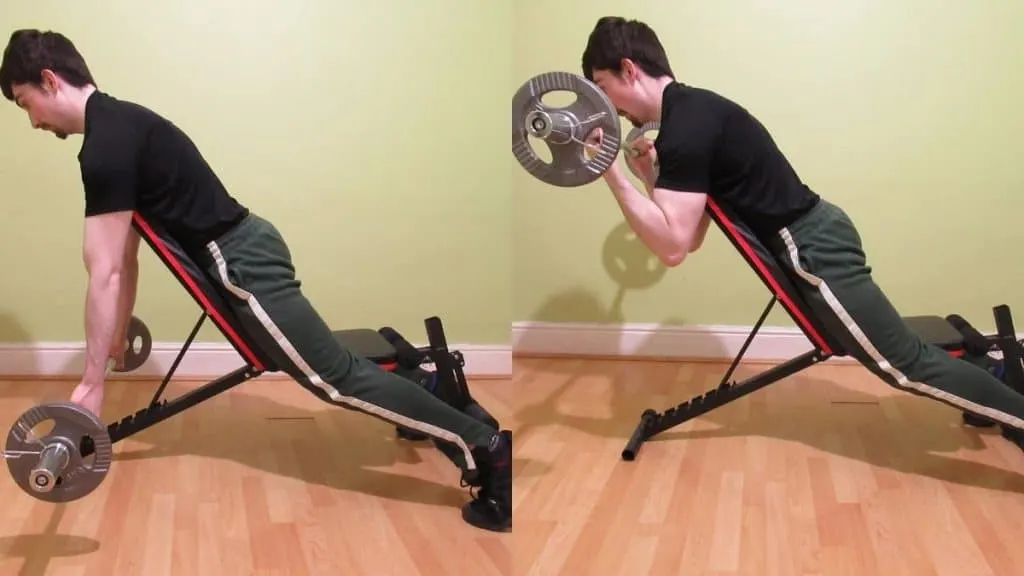 A man doing incline EZ bar spider curls for his biceps