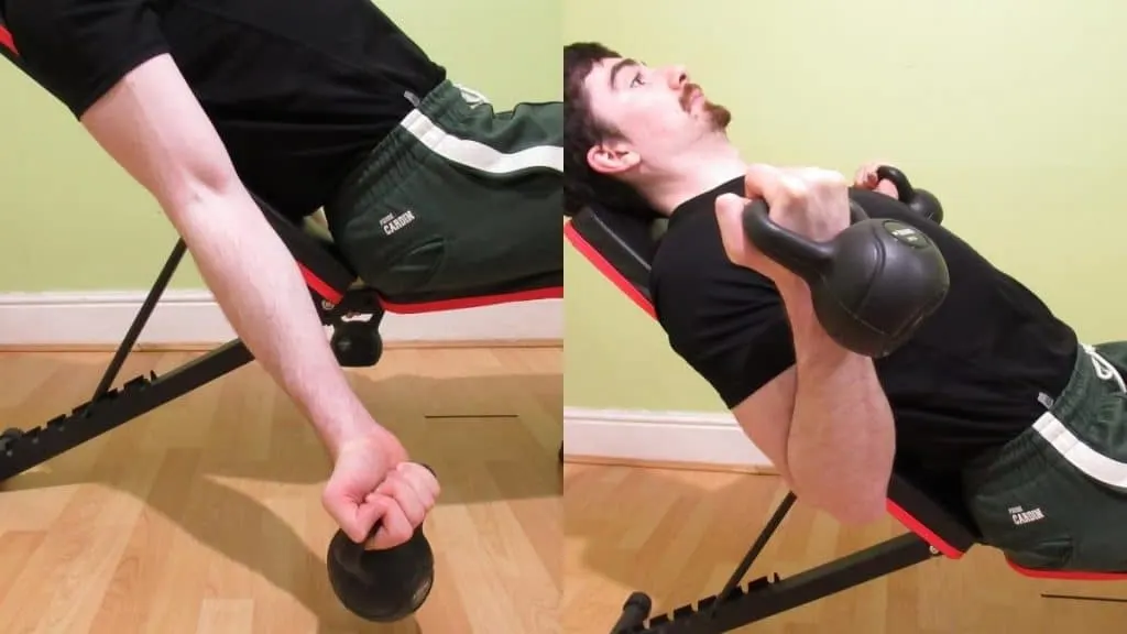 A man performing an incline kettlebell curl