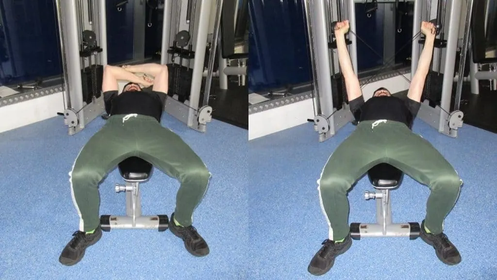 A man doing isolateral cable skull crushers at the gym