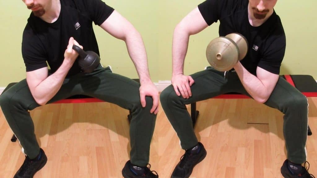 A man performing a side by side kettlebell curl vs dumbbell curl comparison to illustrate the differences