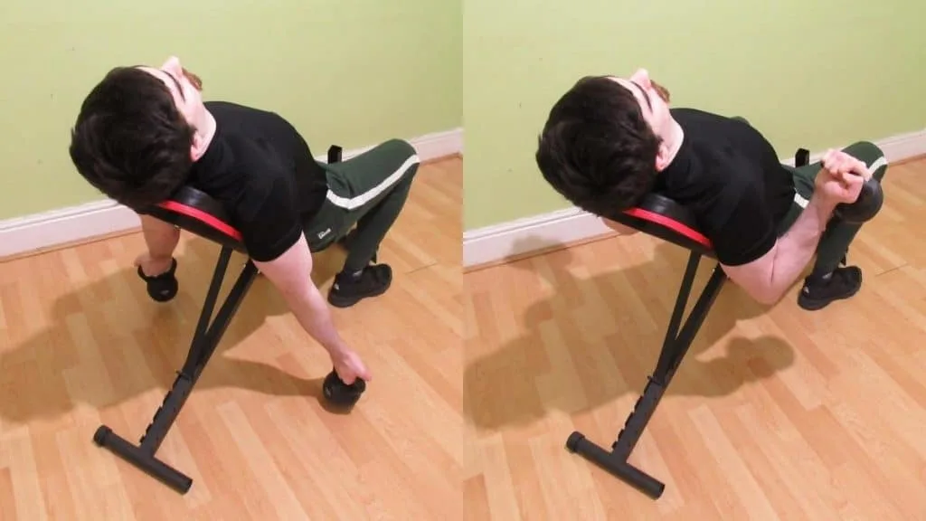 A man doing a kettlebell incline curl