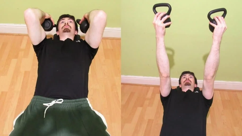 A man doing a kettlebell reverse grip skull crusher