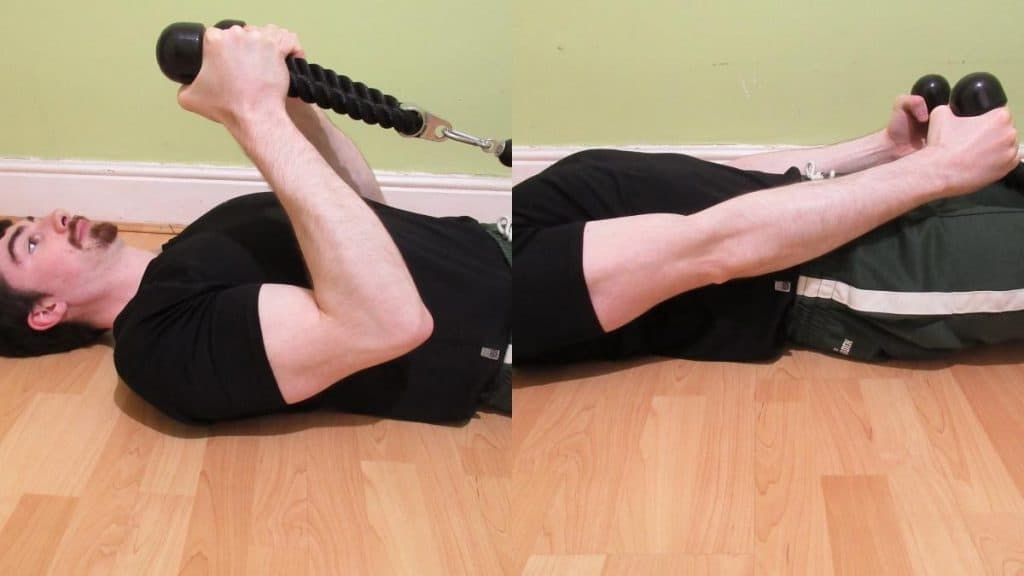 A man doing a lying cable curl with a rope